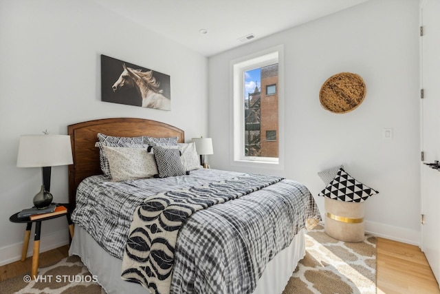 bedroom featuring wood-type flooring