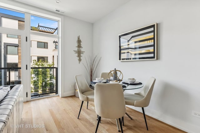 dining area with light hardwood / wood-style flooring