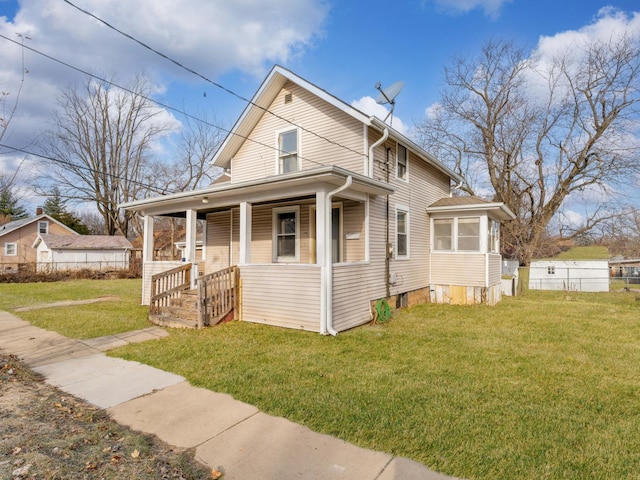 view of front of house with a porch and a front yard