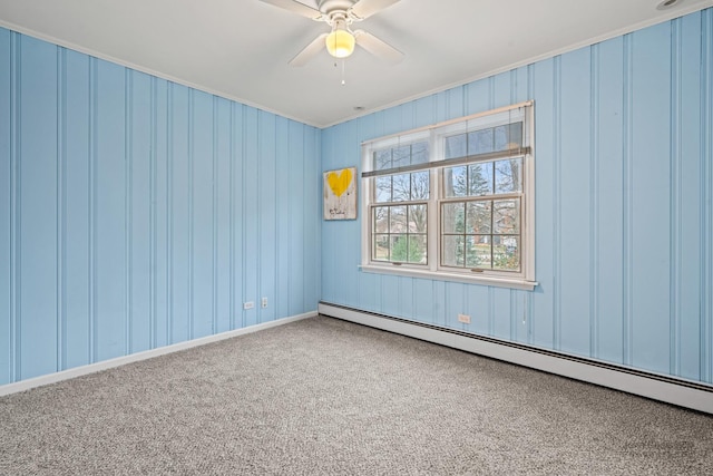 carpeted empty room with baseboard heating and ceiling fan