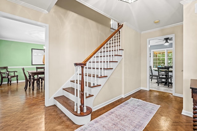 stairs featuring ceiling fan, parquet flooring, and crown molding