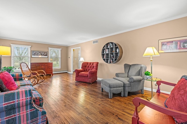 living room with hardwood / wood-style floors, a baseboard radiator, and ornamental molding