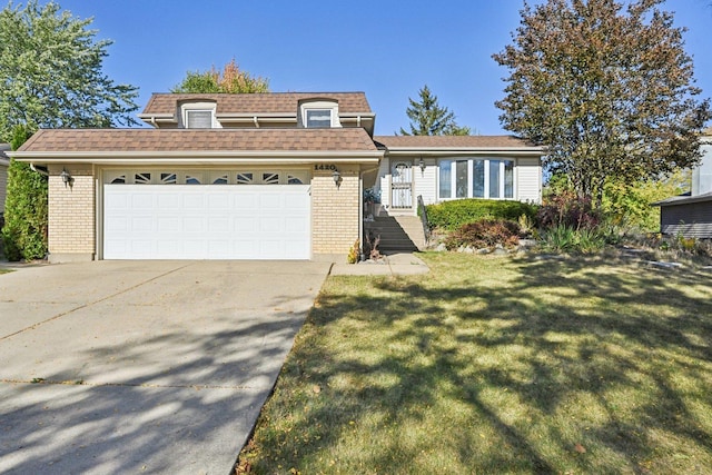 view of front of home featuring a front lawn and a garage