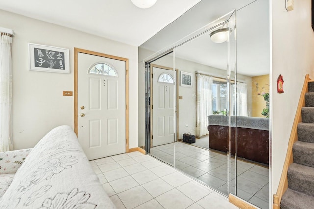 tiled entrance foyer featuring plenty of natural light