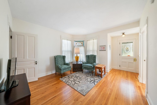 living area with wood-type flooring