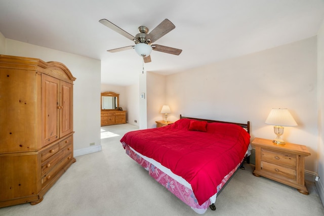 bedroom featuring ceiling fan and light carpet