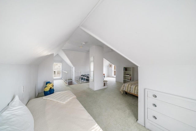 carpeted bedroom featuring vaulted ceiling