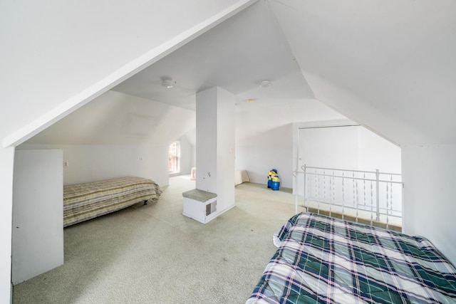 carpeted bedroom featuring vaulted ceiling