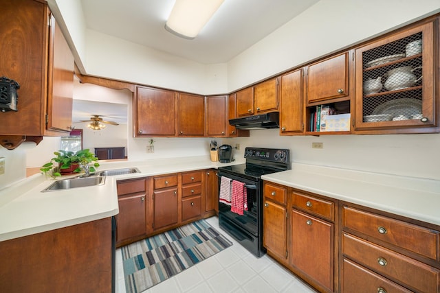 kitchen with black range with electric stovetop, ceiling fan, and sink