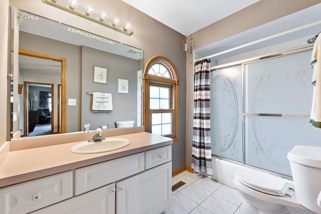 full bathroom with toilet, tile patterned flooring, shower / tub combo, and vanity