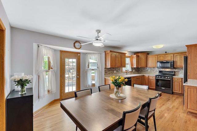 dining room featuring ceiling fan and light hardwood / wood-style floors