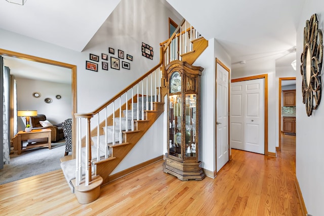 stairway with hardwood / wood-style flooring