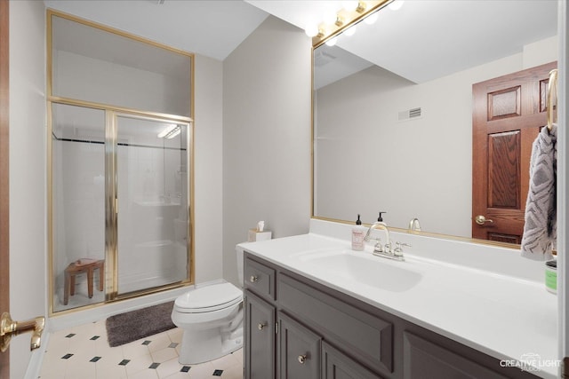 bathroom with toilet, walk in shower, and vanity