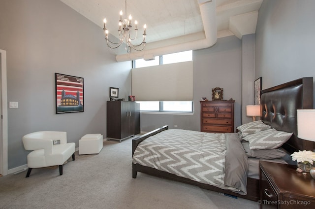 bedroom with light carpet, multiple windows, and a notable chandelier