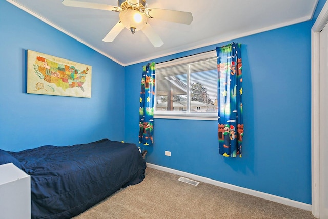 carpeted bedroom featuring ceiling fan and vaulted ceiling