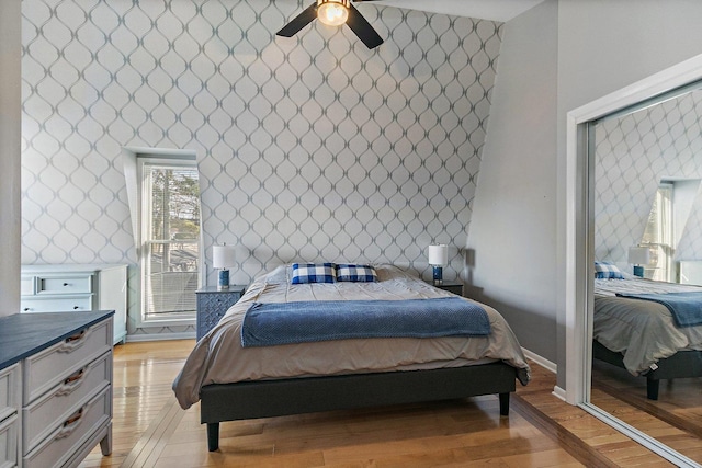 bedroom with ceiling fan and light hardwood / wood-style floors