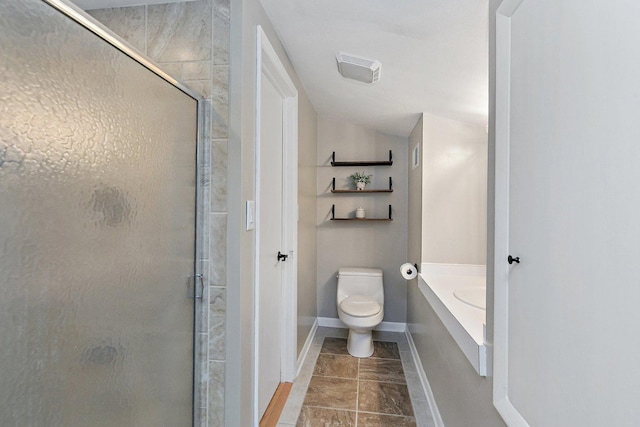 bathroom featuring toilet, an enclosed shower, and vaulted ceiling