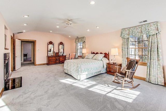 carpeted bedroom featuring ceiling fan and lofted ceiling