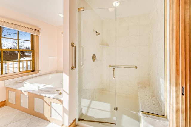 bathroom with tile patterned floors and independent shower and bath