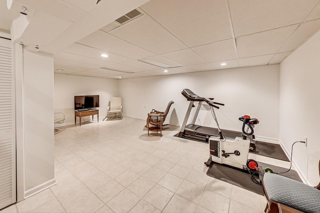 workout room with a drop ceiling