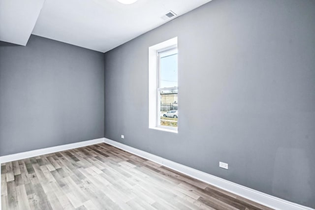 unfurnished room featuring light wood-type flooring