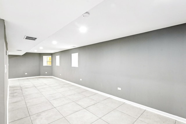 basement featuring light tile patterned floors