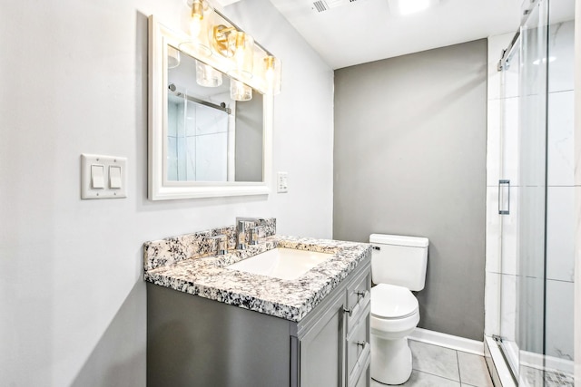 bathroom with an enclosed shower, vanity, a baseboard heating unit, tile patterned flooring, and toilet