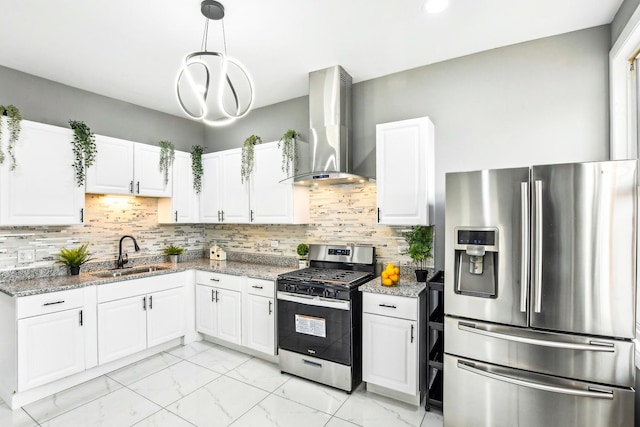 kitchen with sink, stainless steel appliances, wall chimney range hood, light stone counters, and white cabinets