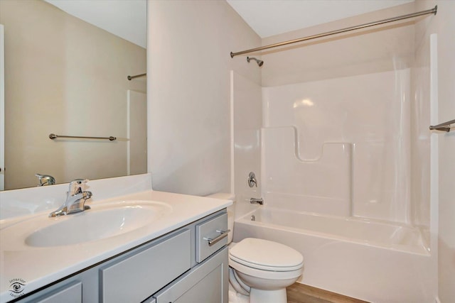 full bathroom featuring vanity, toilet, shower / bath combination, and wood-type flooring