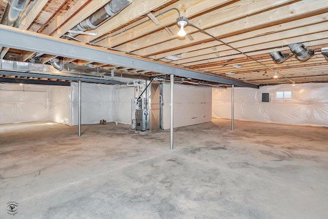 basement with electric panel and heating unit