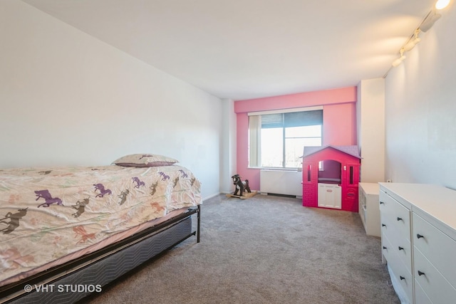 bedroom featuring light carpet