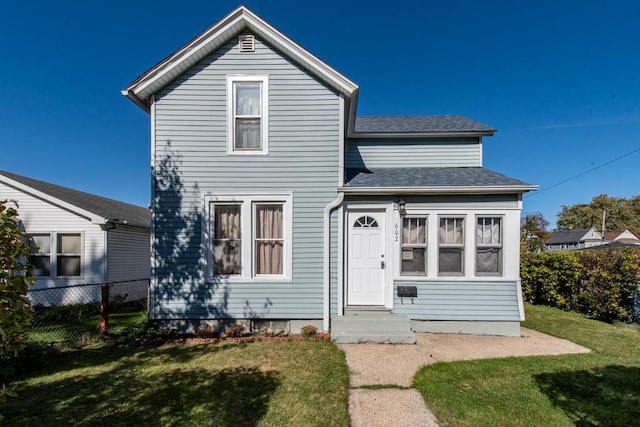 view of front of home with a front lawn