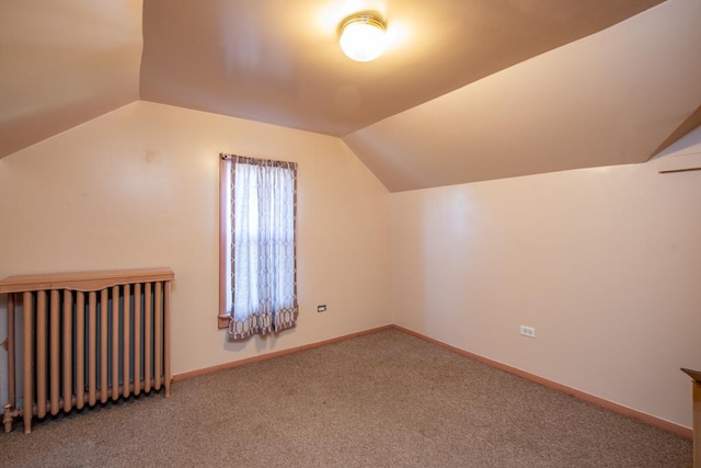 bonus room featuring carpet flooring and lofted ceiling