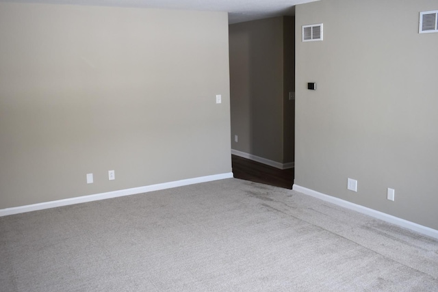 spare room featuring carpet