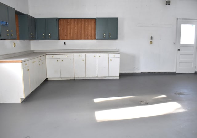 kitchen featuring white cabinets