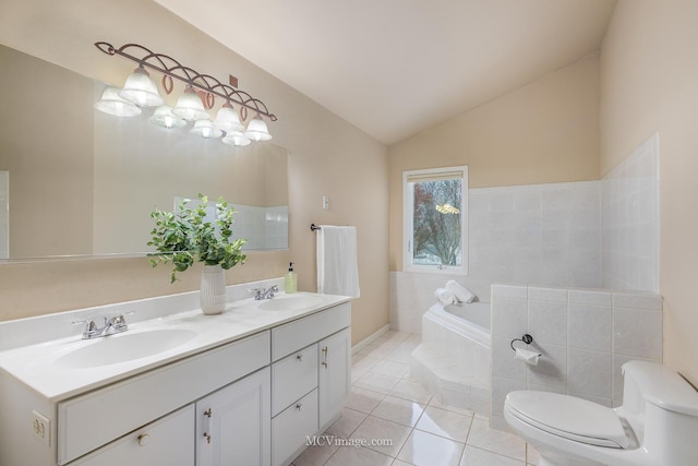 bathroom featuring tile patterned flooring, a relaxing tiled tub, lofted ceiling, toilet, and vanity