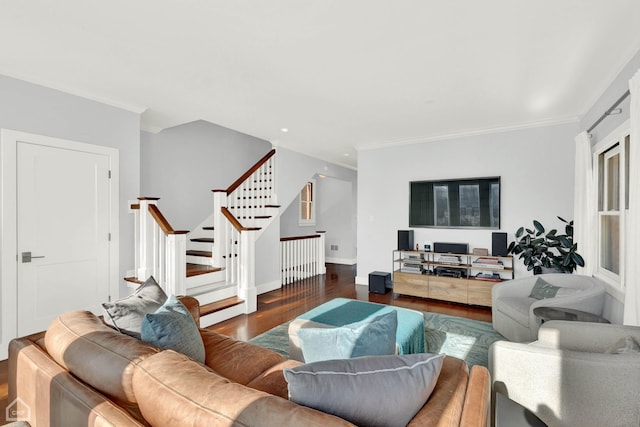 living room with dark hardwood / wood-style flooring and crown molding