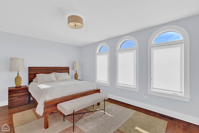 bedroom featuring dark hardwood / wood-style floors