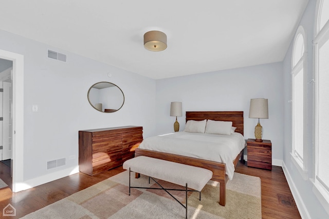 bedroom featuring dark hardwood / wood-style flooring