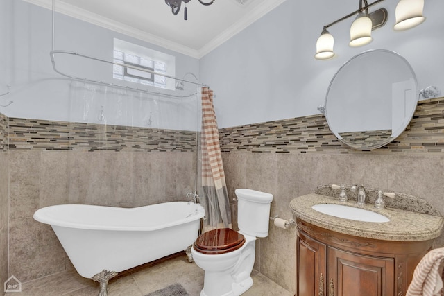 bathroom with crown molding, tile walls, vanity, a bath, and toilet