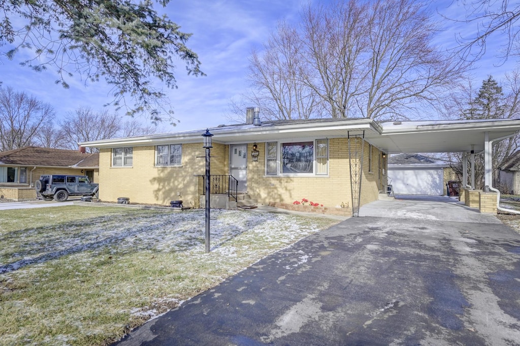 view of front of property with a carport