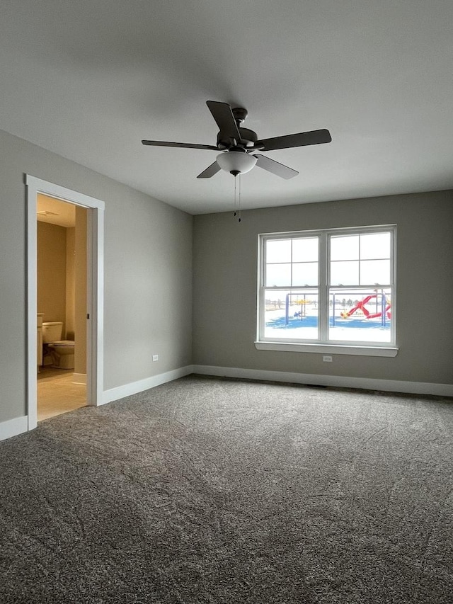 spare room with carpet floors and ceiling fan