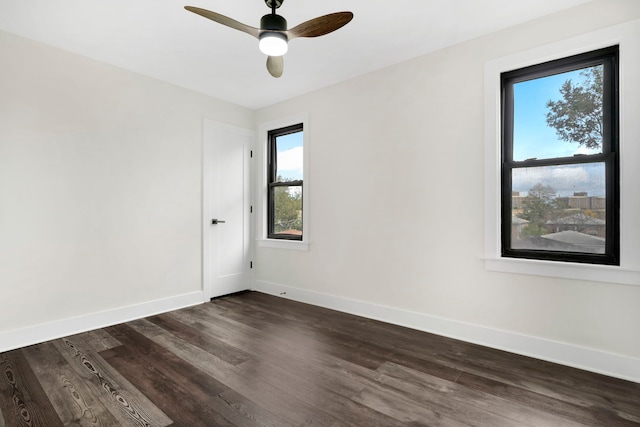 unfurnished room featuring ceiling fan and dark hardwood / wood-style flooring