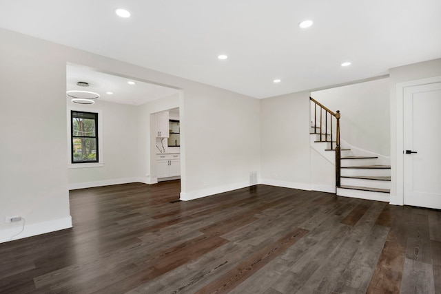 spare room featuring dark hardwood / wood-style floors