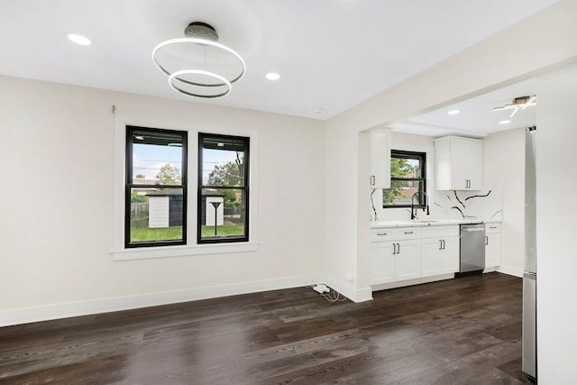 unfurnished dining area featuring dark wood-type flooring and sink