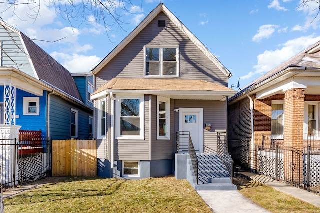 bungalow-style home featuring a front lawn