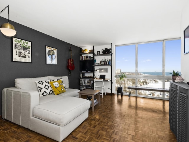 living room featuring floor to ceiling windows, indoor bar, and dark parquet floors