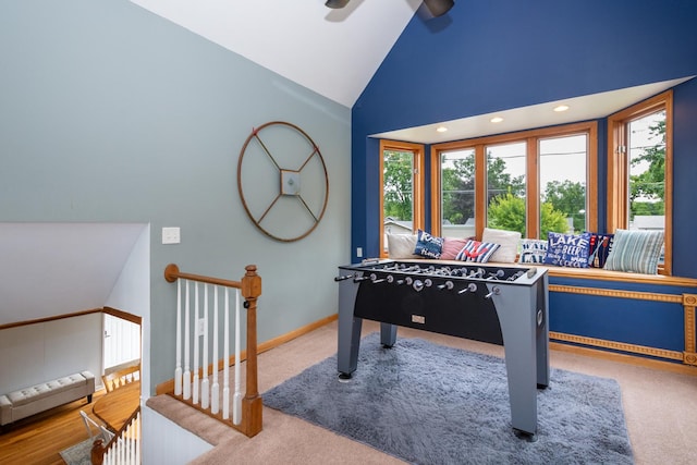 playroom featuring carpet flooring, ceiling fan, and lofted ceiling