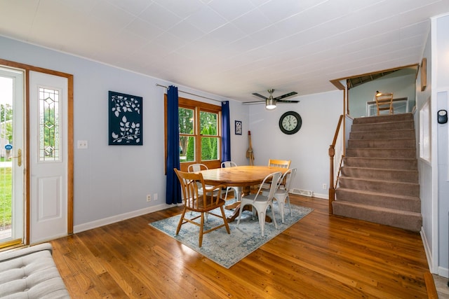 dining area with hardwood / wood-style floors, ceiling fan, and a healthy amount of sunlight