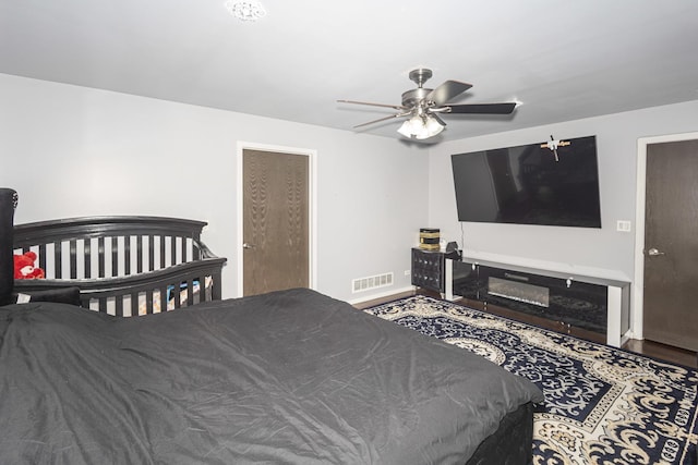 bedroom featuring ceiling fan and hardwood / wood-style floors